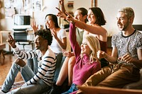 Friends watching a game show on the tv