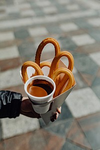 Woman holding a churros snack