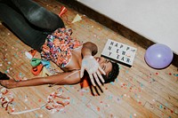 Happy woman on the floor at a party