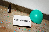 Let&#39;s party sign mockup on a wooden floor mockup