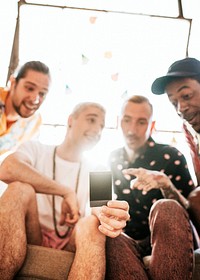 Diverse group of friends checking groupfie photo