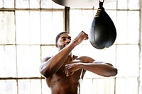 Muscular male boxer at the gym