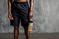 Sportive man holding a water bottle