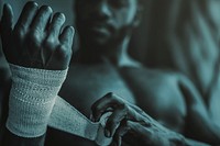 African American man wrapping her hand, ready for weightlifting