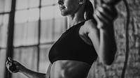 Sporty woman exercising by jump rope at the gym woman 