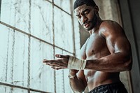 African American man wrapping her hand, ready for weightlifting