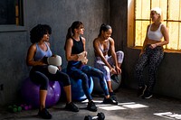 Sportive women talking in a gym