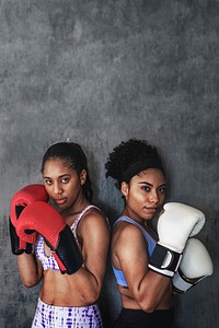 Muscular sportive women ready to box