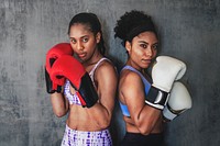 Muscular sportive women ready to box