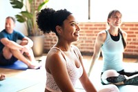 Sportive people in a yoga class