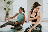 Group of sportive people in yoga class