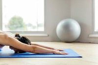 Fitness woman in a Balasana pose