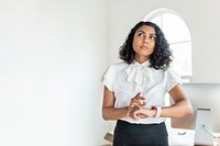 Black businesswoman using a smartwatch 