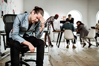 A stressed businessman having a break during a meeting