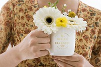 Girl with flowers in her coffee cup mockup