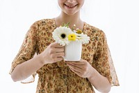 Girl with flowers in her coffee cup