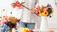 Young florist making a beautiful flower arrangement