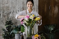 Young florist making a beautiful flower arrangement