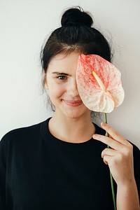Beautiful young girl with a flaming flower