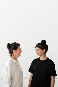 Cheerful mom and daughter talking in a room