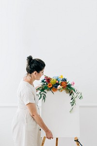 Woman with a floral greeting canvas frame<br />