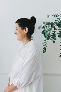 Portrait of a cheerful woman in a white linen