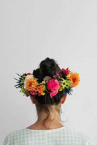 Beautiful woman with a midsummer floral wreath