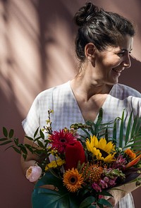 Woman with a beautiful tropical bouquet