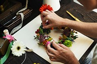 Woman making a floral midsummer wreath