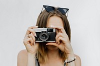 Woman using a compact camera
