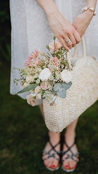 Woman with a woven bag full of flowers