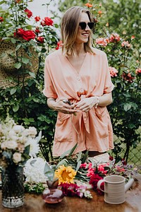 Woman arranging flowers in a garden
