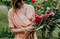 Woman arranging flowers in a garden