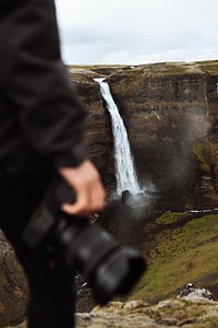 Photographer at the Haifoss waterfall, Iceland