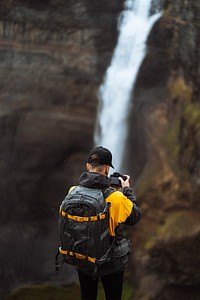 Photographer at the Haifoss waterfall, Iceland