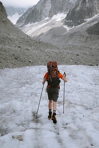 Hiker going up Chamonix Alps in France