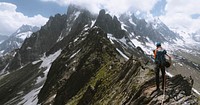 Backpacker hiking up Chamonix Alps in France