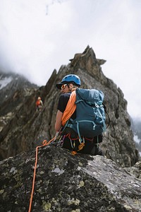 Rock climber going up the Chamonix Alps in France