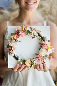 Bride holding a flower wreath