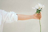 Woman holding a peony snow board