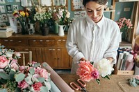 Woman preparing and arranging flowers