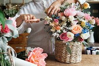 Woman preparing and arranging flowers