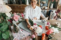 Florist arranging a bouquet of flower