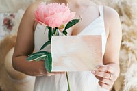 Bride holding a blank white card mockup
