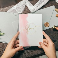 Woman with a wedding invitation card