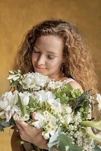 Woman holding a bouquet of white flowers