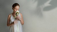 Woman with a white paeonia snowboard flower