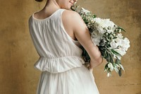 Woman holding a bouquet of white flowers