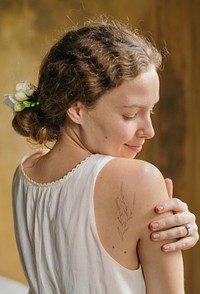 Girl with white freesia flowers in her hair