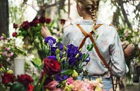 Florist arranging flowers in her shop